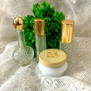 Set of 4 Vintage Perfume Bottles. Nice for display. Good vintage condition